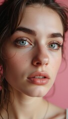 Fototapeta premium Close-up portrait of a young woman with captivating blue eyes
