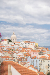 Fototapeta premium Stunning travel and lifestyle photography of Lisbon, Portugal, showcasing its famous red rooftops, main tourist attractions, and romantic experiences for couples.
