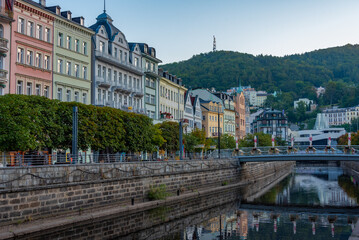Fototapeta premium Sunset view of colourful houses reflecting on Tepla river in Kar