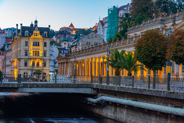 Fototapeta premium Night view of colourful houses reflecting on Tepla river in Karl
