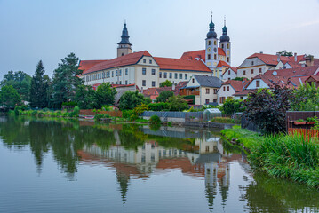 Fototapeta premium Sunset reflection of Telc castle in Czech republic