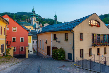 Fototapeta premium Sunrise view of a street in the old town of Banska Stiavnica, Sl