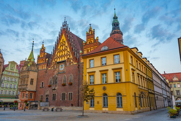 Fototapeta premium Sunrise view of town hall at Rynek, the picturesque square in ce