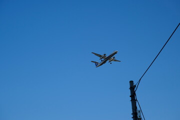 Minimalist Travel Background: A Passenger Plane with Ample Copy Space in the Sky