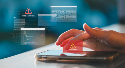 Close up of hand using smartphone with digital overlays showing system hacked warning Cybersecurity...