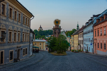 Fototapeta premium Sunrise view of the holy trinity square in Banska Stiavnica, Slo
