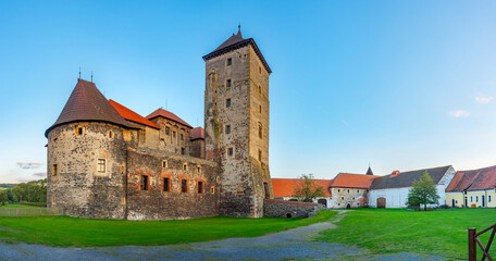 Obraz premium Sunset view of water castle Svihov in Czech republic