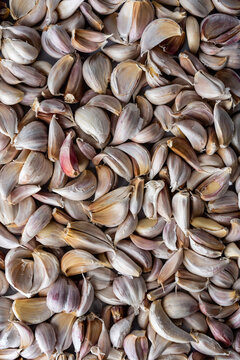 Closeup of cloves of garlic with the skin still on 