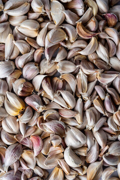 Closeup of cloves of garlic with the skin still on 