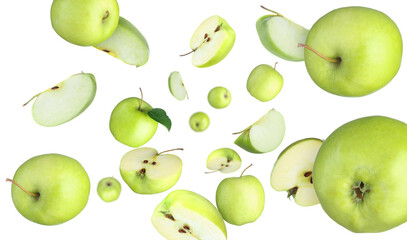 Fresh green apples swirling in air against white background