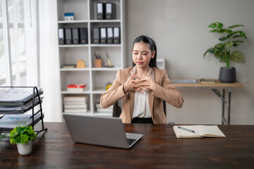 Businesswoman signing during a video conference in her office