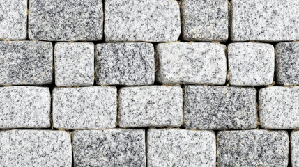 Fototapeta premium Speckled granite cobblestone texture in light gray tones arranged geometrically, perfect for clean architectural visualizations or design mockups