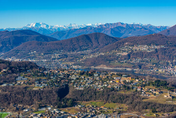Fototapeta premium Panorama of Alps viewed behind Lugano from Monte San Giorgio in