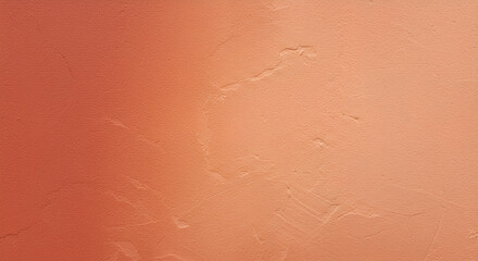 A textured terracotta wall evokes warmth and rustic charm through its gradient finish and subtle