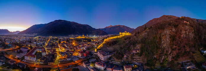 Sunset view of Bellinzona with Castelgrande, Castello di Montebe © dudlajzov