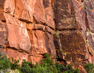 Close-up of colorful rock face with crevices and textures