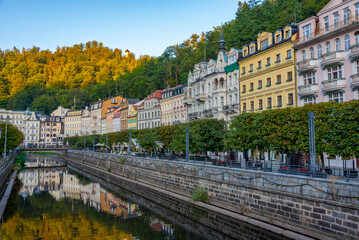 Fototapeta premium Sunset view of colourful houses reflecting on Tepla river in Kar