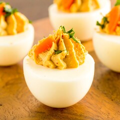 Deviled eggs on a wooden surface