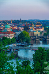 Naklejka premium Sunset view of Charles bridge and the National theatre in Prague