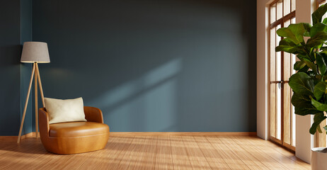 A stylish and minimalist living room with a rich dark blue wall, a comfortable tan leather...
