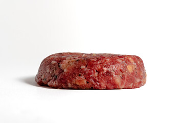 raw beef burger patty isolated on white background