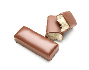 Tasty chocolate covered coconut candies on white background