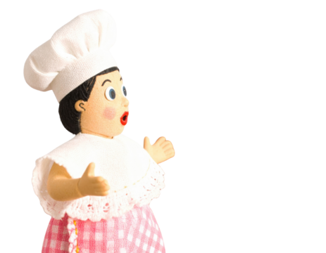 Adorable vintage chef doll with a surprised expression wearing a traditional uniform.