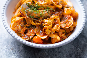 italian seafood pasta in tomato sauce