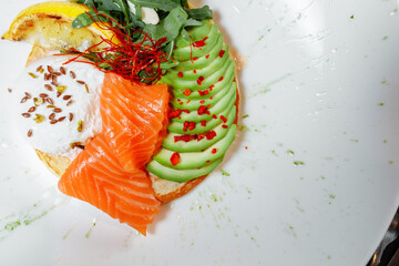 Summer healthy fastfood lunch, breakfast with Pancake with red fish, avocado and egg for breakfast. Aesthetic still life, healthy food concept