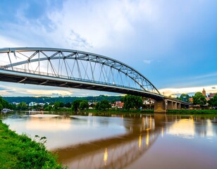 Naklejka premium Bridge over a river at sunset