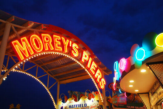 The entrance to Morey&rsquo;s Piers in Wildwood, New Jersey, on the Jersey Shore, is illuminated against the dusk sky