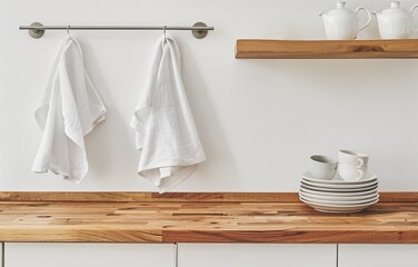 White kitchen with wooden shelves and towels