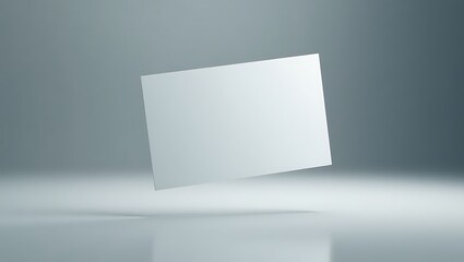 Naklejka premium Blank white business card floating in a minimalist studio. Mockup for branding identity and corporate presentation with copy space