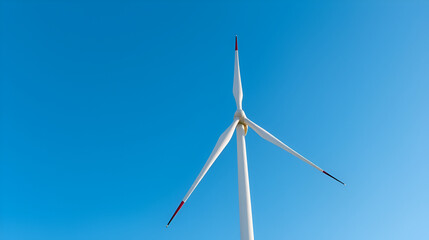 Green energy, wind turbine generating clean electricity against a bright blue sky , turbine blades, nacelle, wind power plant