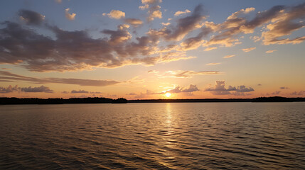 Naklejka premium unset at the lake And the sky with golden clouds.