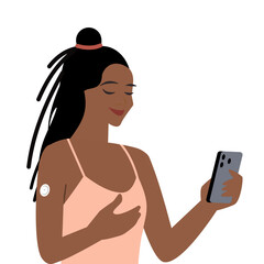 Waist-up portrait of young woman wearing continuous glucose monitor attached to the upper part of her arm, checking records in smartphone application