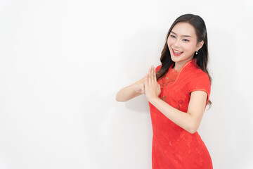 Beautiful Asian woman in cheongsam or Chinese dress on white background, Chinese New Year culture.