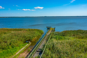 Obraz premium Broken pier at Leba lake in Slowinski national park in Poland