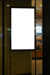 Clear street signage board placed by an outdoor dinning area of a restaurant at night