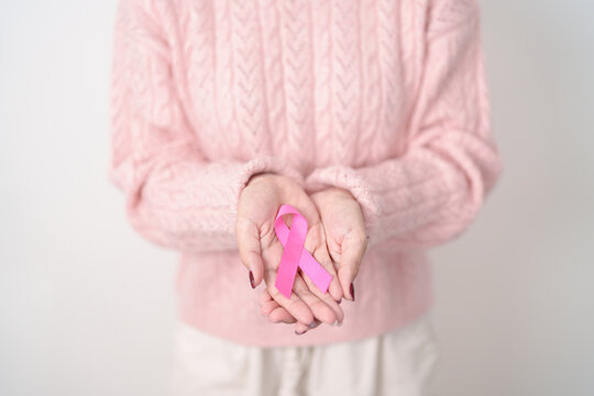 Pink October Breast Cancer Awareness month, woman with pink Ribbon for concepts of support people life and illness. National cancer survivors month, Women Health day and February World cancer day