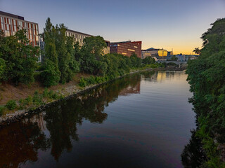 Fototapeta premium Karlin district reflected on Vltava river in Prague, Czech repub