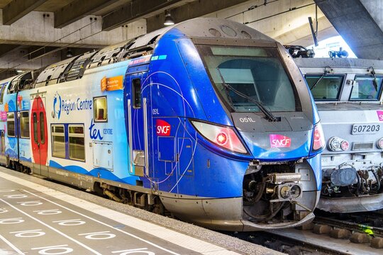 Paris, France, 20.07.2024 - This image features a modern SNCF TER train at a bustling station in Paris, showcasing efficient travel options and the vibrant atmosphere of the city.