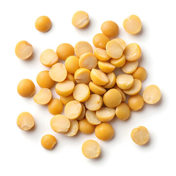 Close-up of split pigeon peas isolated on a white background, showing their flat, yellow halves
