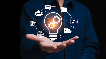 Innovative technology concept with glowing light bulb and digital icons demonstrating business ideas