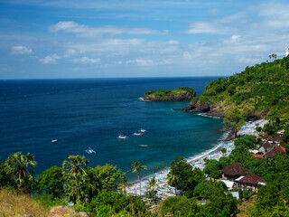 Panoramic view of Bali coastline with beach, cliffs and turquoise ocean