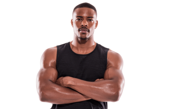 Confident man with muscular arms, arms crossed, wearing black tank top, looking directly at the camera.