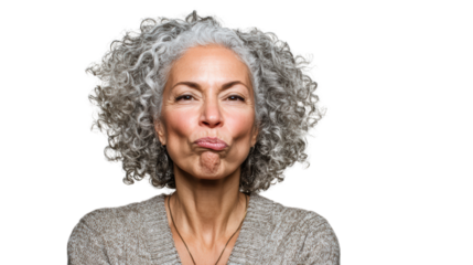 Confident woman with curly grey hair making an expressive face against a white background.