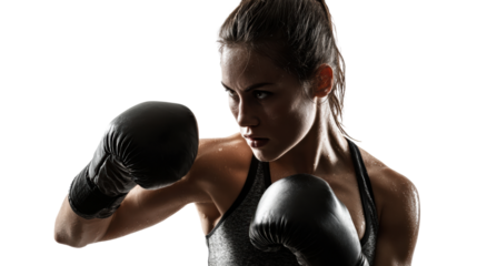 Fierce female boxer in action, focused expression, black gloves, studio lighting, isolated background.