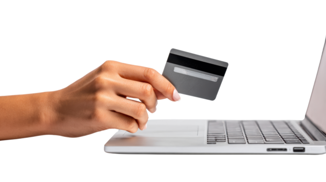 Hand holding credit card over laptop, online shopping concept, white isolated background.