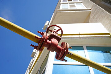 Almaty, Kazakhstan - 08.29.2025 : A gas pipe on the background of multi-storey residential...